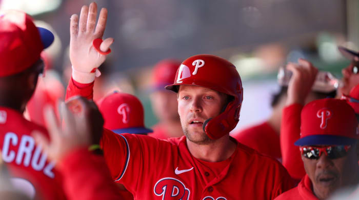 Philadelphia Phillies first baseman Rhys Hoskins (17) is congratulated after hitting a home run against the Boston Red Sox during a spring training game.